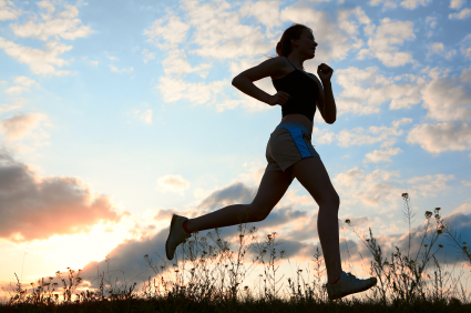 Silhouette woman run under blue sky with clouds Silhouette woman run under blue sky with clouds